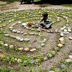 student in stone labyrinth